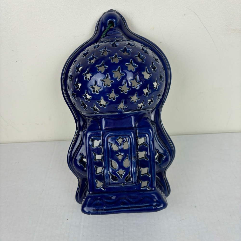 Handmade Tunisian Inspired cutout wall lamp in cobalt blue over terracotta